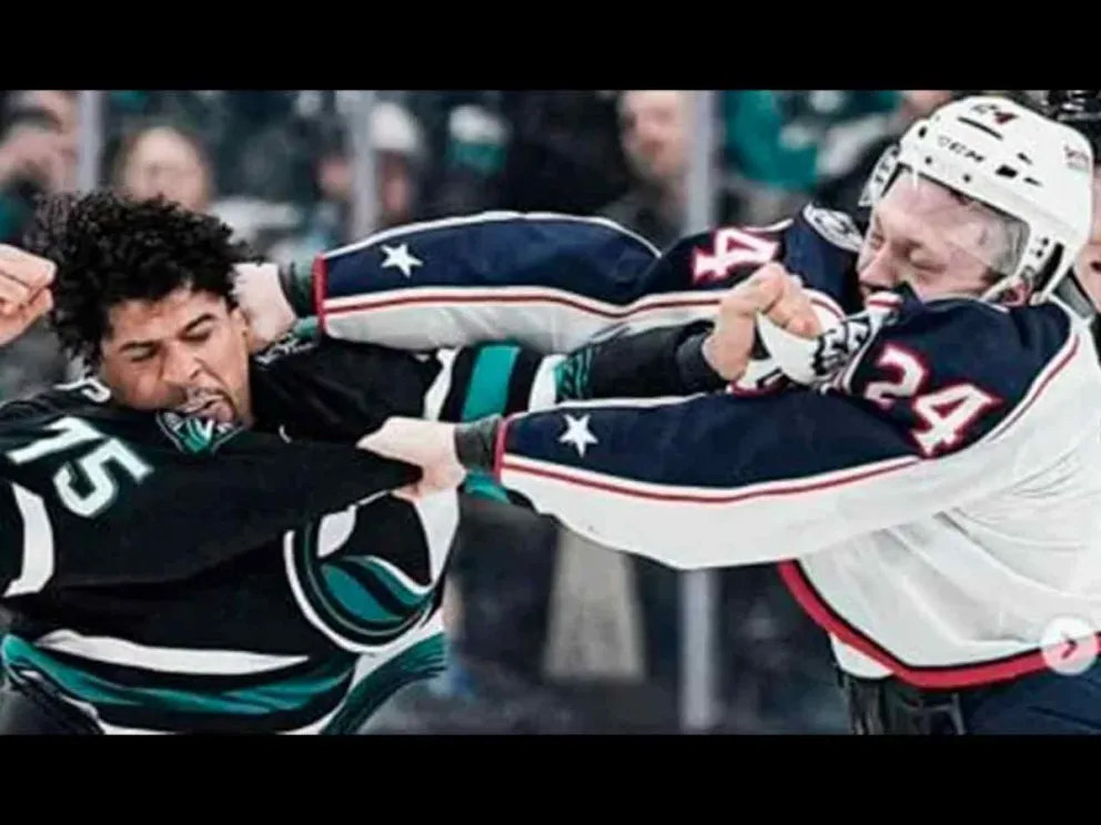 Ryan Reaves y Mathieu Oliver